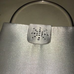 NWOT. Beautiful Silver Handbag w/shoulder strap. Snowflake in rhinestone design